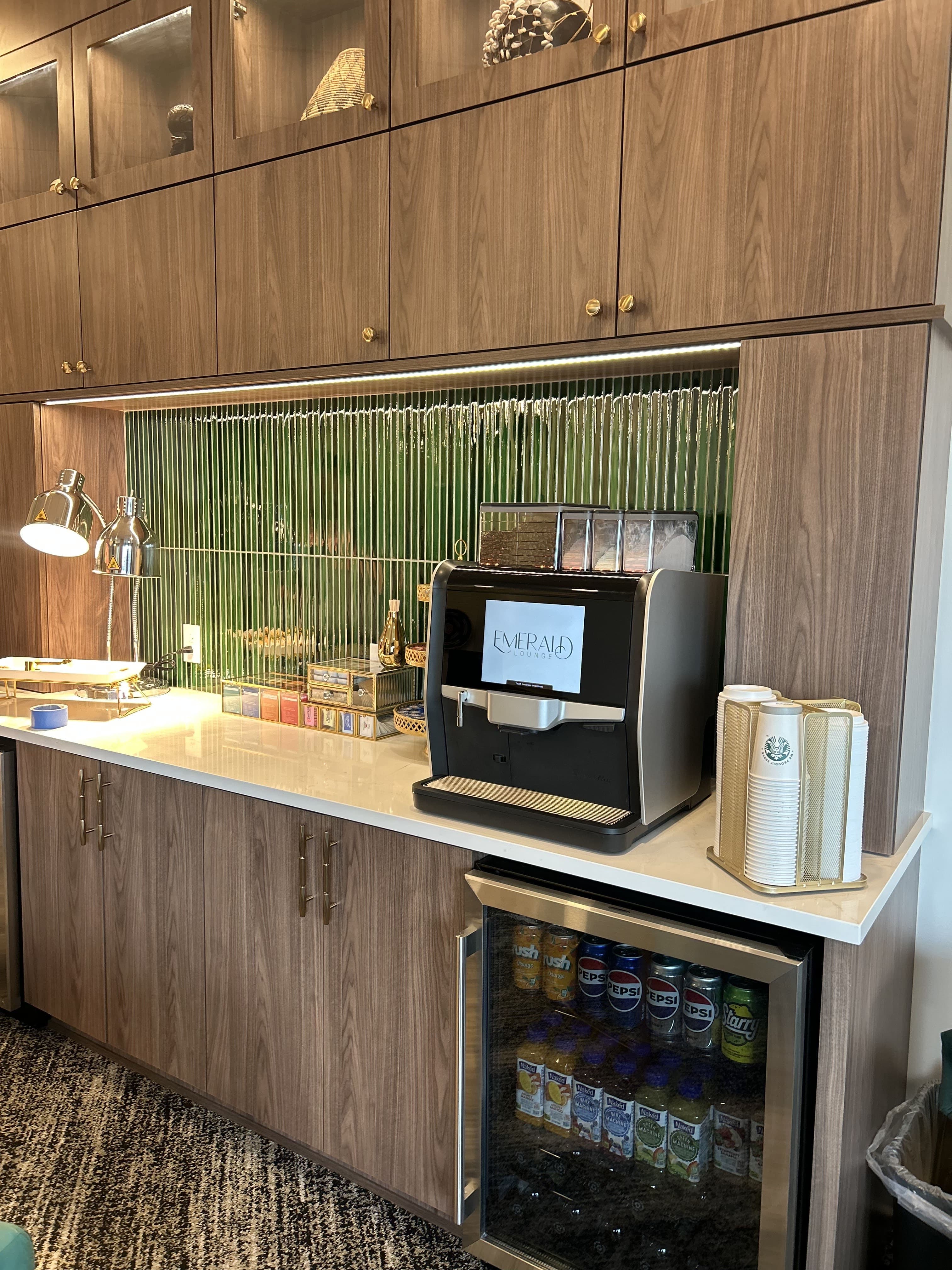 Coffee machine on countertop with many coffee accessories and a built-in digital display